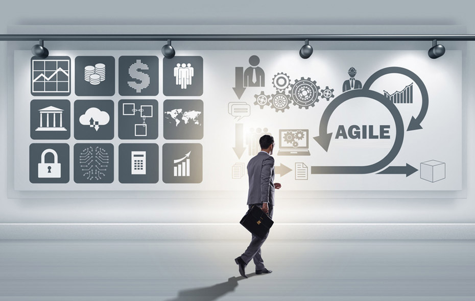 person in suit walking towards a sign that reads 'agile'